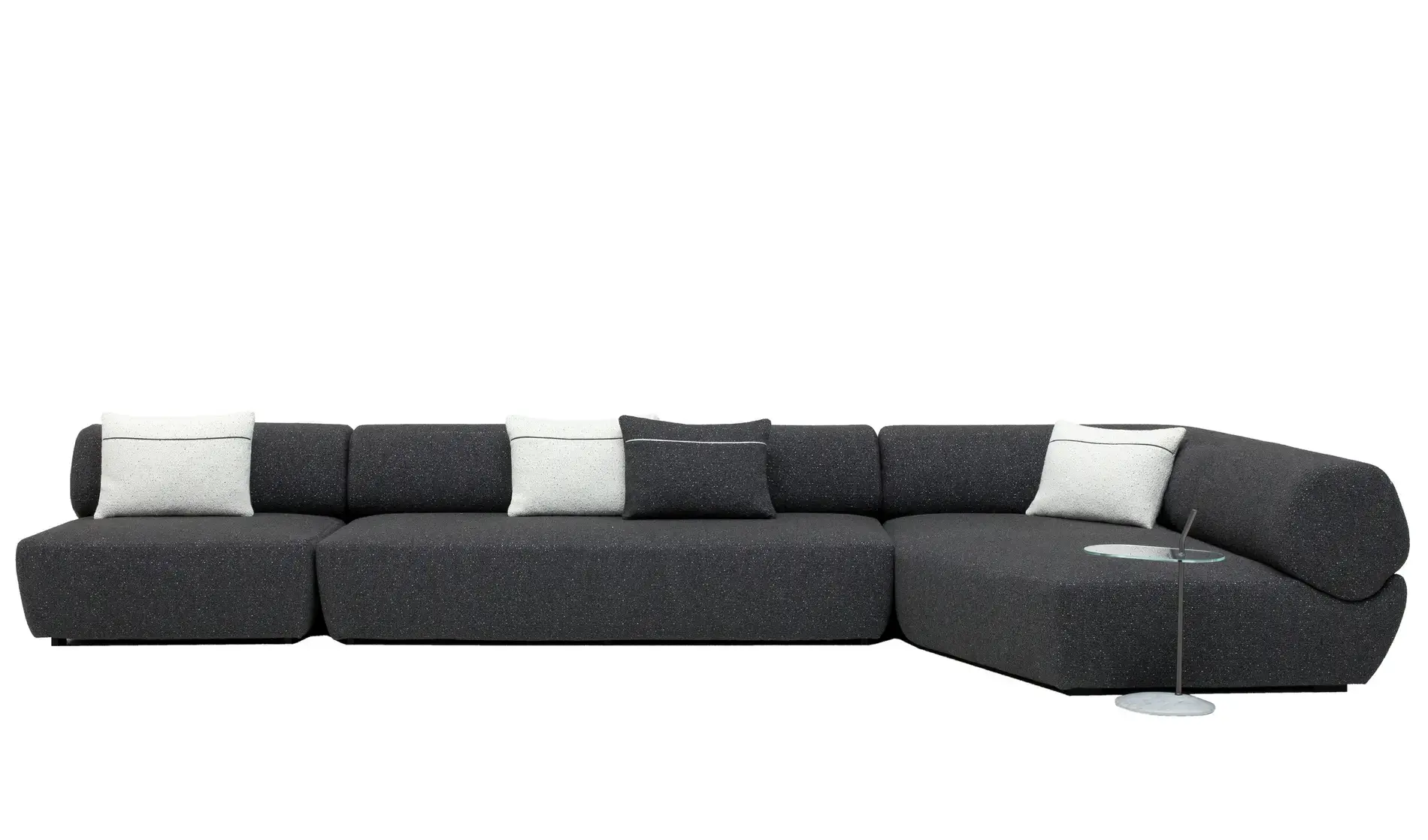 Dark charcoal grey modular sectional sofa with white and black throw pillows, low profile modern design for living rooms in Sri Lanka.